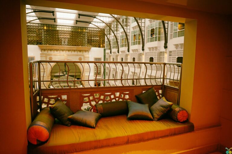 A modern indoor balcony with cozy cushions offering a luxurious ambiance in a well-designed architectural space.