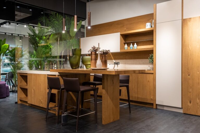 Modern kitchen design with wooden elements and indoor plants, showcasing elegance and style.
